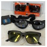 Three pairs of goggles/sunglasses, clip ons and