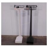 Two doctors office style scales, grey scale