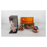 Asian style doll and paper dragon decorations