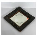 Early Advertising beveled mirror in ornate frame,