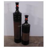 Two tall metal vases,  tallest measures 38"