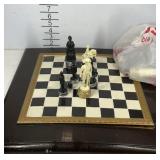 Chess board with game pieces, damage on corner