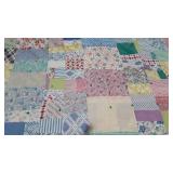 Knotted pastel patchwork quilt, filling has