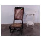 Caned rocking chair with carved details, moldy,