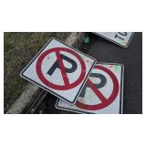 Two No Parking Signs on steel posts, aluminum