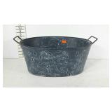 Decorative tin drink cooler tub.