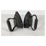 Two cast iron flat irons