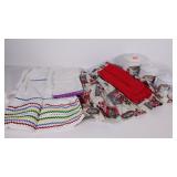 Two aprons, 3 enamel canisters and a dish towel