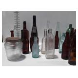 Colored and clear bottles, mostly beer companies.