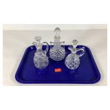 Three blown glass cruets