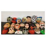 Twenty three Halloween costume masks, including
