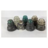 Seven glass insulators