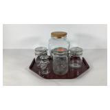 Four Glass canister jars and cookie jar