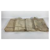 Four striped feed bags, approximately 20x40