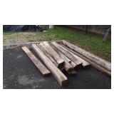 11-Wood 7ft Half Round Fence Posts, and one