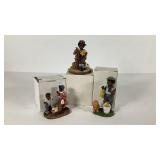 Three poly resin figures with boxes