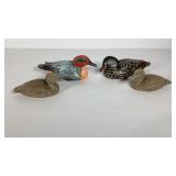 Four duck statues, two wood, two poly resin
