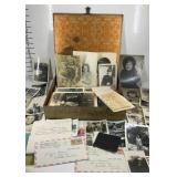 Tin storage box with black and white pictures and
