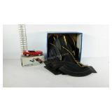 Box of slot car tracks and a push button phone