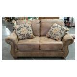 Love seat, leather look, two pillows, 64" wide