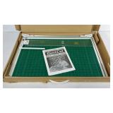 Quilt Cut, fabric cutting system with box and