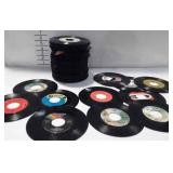 Stack of records, no covers.  A few are  Muddy