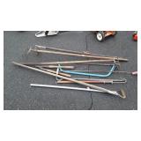 Tools, claw rakes, hoe, tree limb Saw, crow bar,