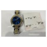 Wrist watch not running and four pairs of