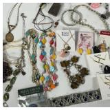Flat of costume jewelry, necklaces, bracelets,