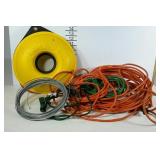 Assorted extension cords and partial coil of