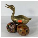 Brass duck statue and pair of maracas