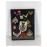 Military rank patches in display case