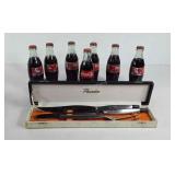 7 Coca-Cola bottles and a carving knife set