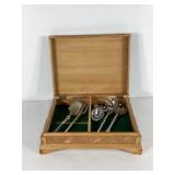 Serving utensils in carved box