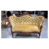 Parlor settee, carved details, fabric frayed