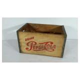 Pepsi-cola wooden crate with metal banding.