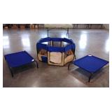 Two raised dog beds and a soft sided pen, door
