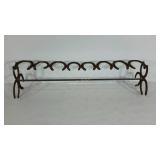 Boot rack made with horseshoes and rebar. Boot