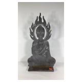 Sitting Buddha yard art, shows some weathering,