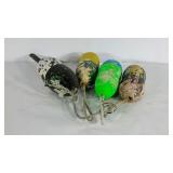 Four bouys with flaking paint.
