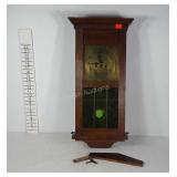 Wall hanging pendulum clock with green stained