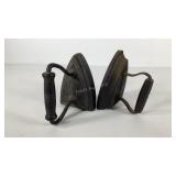Two cast iron flat irons