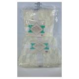 Two reversible faux fur throws. New in packaging.