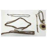 Four pocket watch chains and a 1902 Indian head