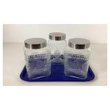 Three glass canister jars
