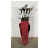 Group of golf clubs in a nylon bag, used