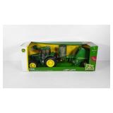 Big farm John Deere 7330 tractor and round baler