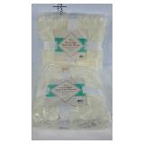 Two reversible faux fur throws. New in packaging.