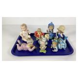 Eight porcelain children figurines