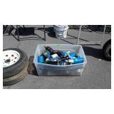 Plastic tote with propane and other cylinders,